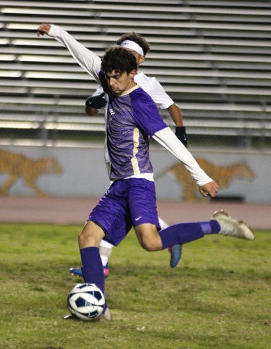 Lemoore's David Mendez takes a shot against Monache Tuesday night in Tiger Stadium. The Tigers won 3-1.